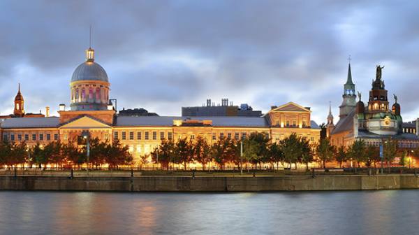 Old architecture at dusk on street in Old Montreal in Canada panorama