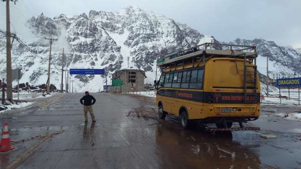 Juber poses with the lunch bus as we begin the descent in to Chile!
