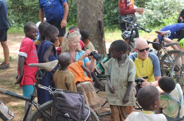 Jill Robertson with Martyn Wells looking at pics with the children