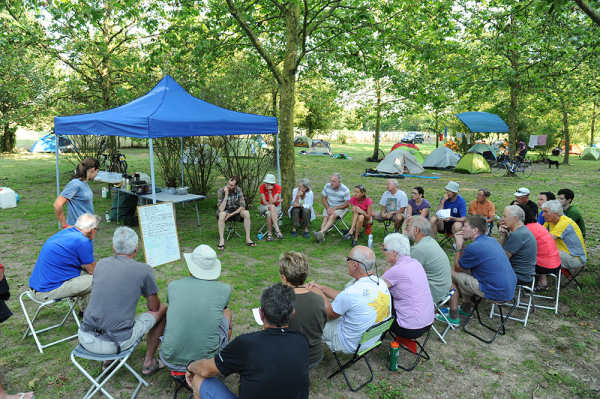 Rider meeting. Everybody concentrated watching the whiteboard of tomorrows ride