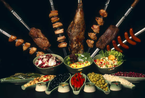 A churrascaria is a Brazilian steakhouse. Churrasco is the cooking style, which translates roughly from the Portuguese for 'barbecue'.