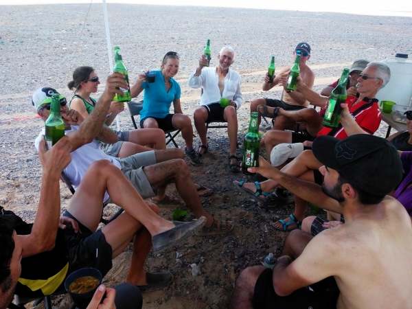 Riders enjoying a drink after 150km