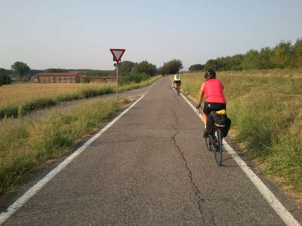 Italy - Carol and Walker riding long the Po river