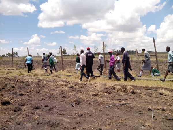 Students and members of Green Heroes Planting Trees