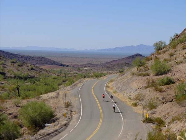 Riders embark on a long journey through the desert.