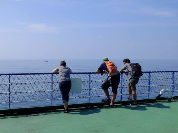 Tom chats to other passengers on ther ferry