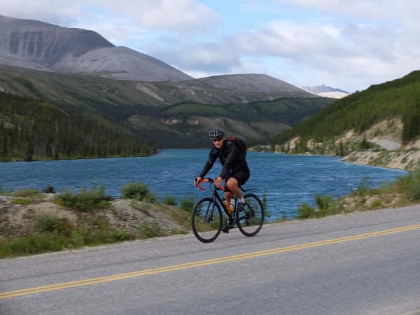 Chris pedals past Summit Lake.
