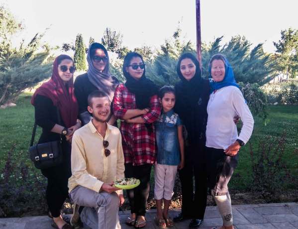 Charlie and Ruth pose for a photo with some local Iranians