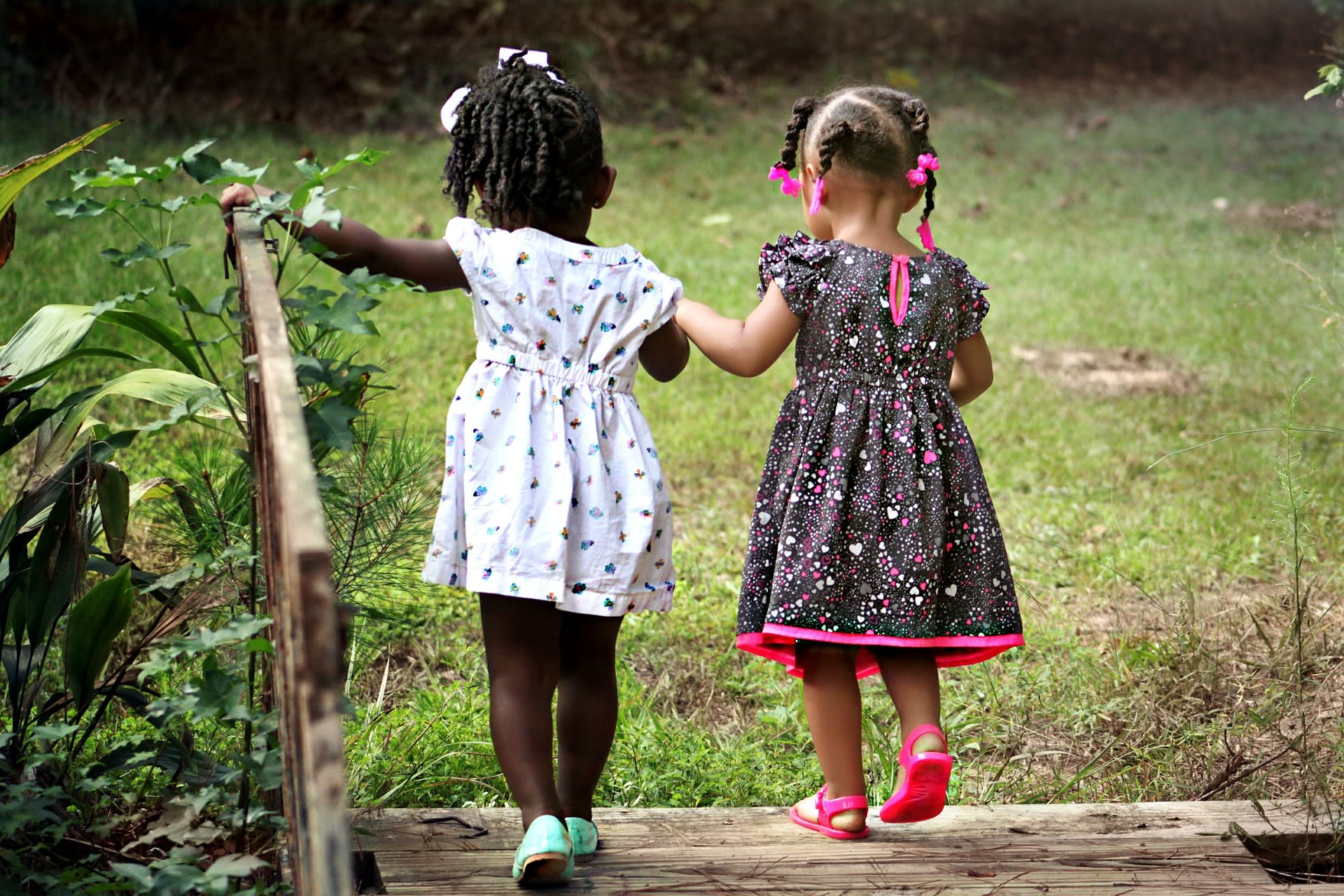 large image of girls holding hands