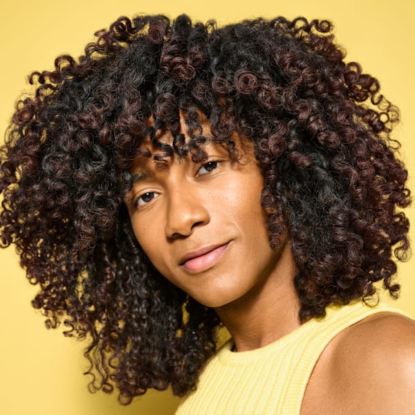 person with full curly hair