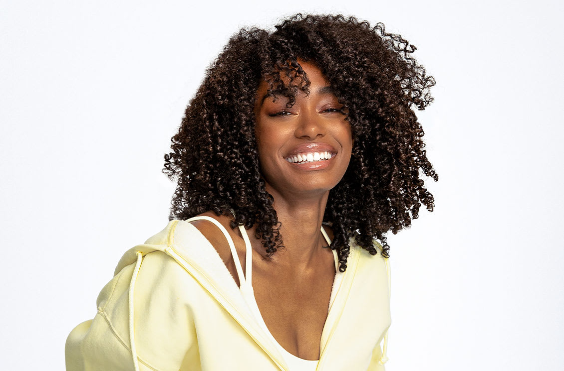 woman with dark curly, coily hair