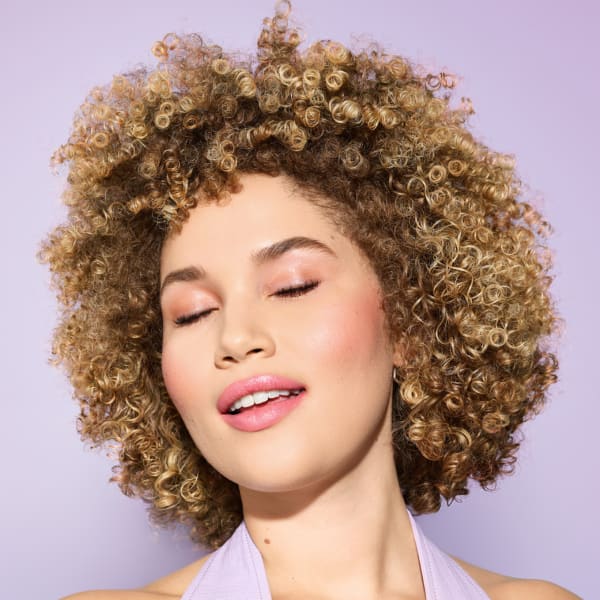 Woman with blonde curly hair