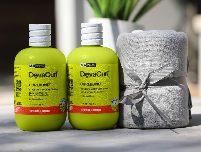 CurlBond™ Cleanser & Conditioner next to DevaTowel