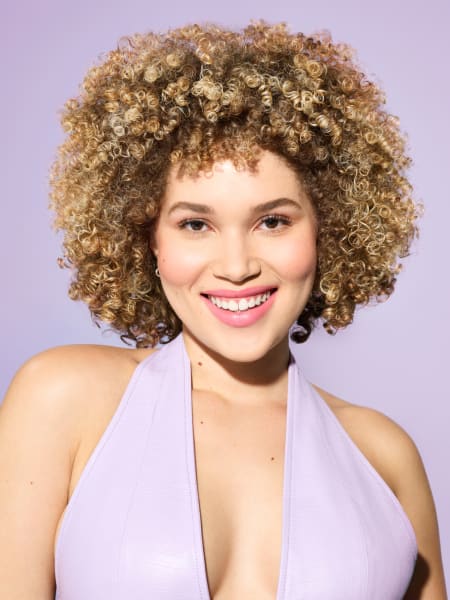 model with blonde curly hair