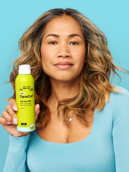 smiling woman with blow dried waves