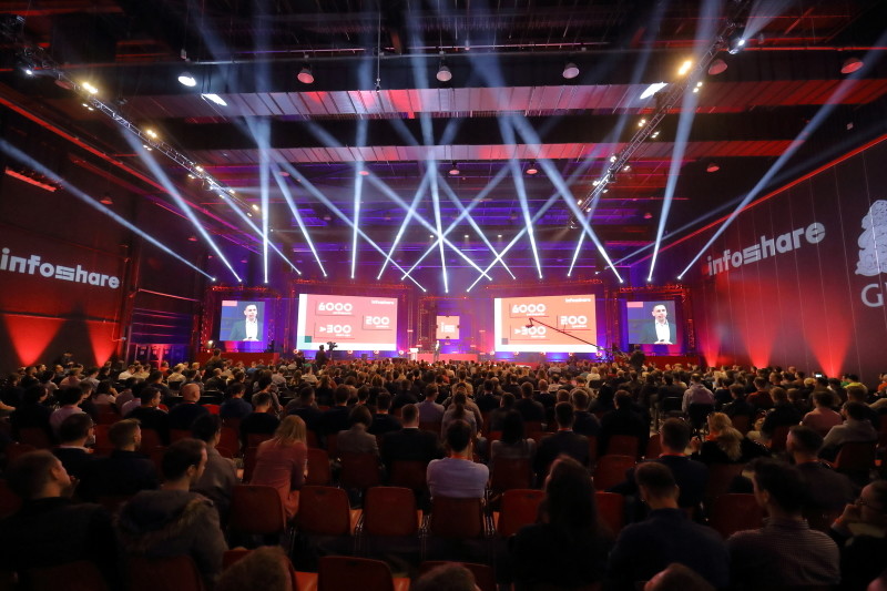 A photograph of a packed conference hall at infoshare.