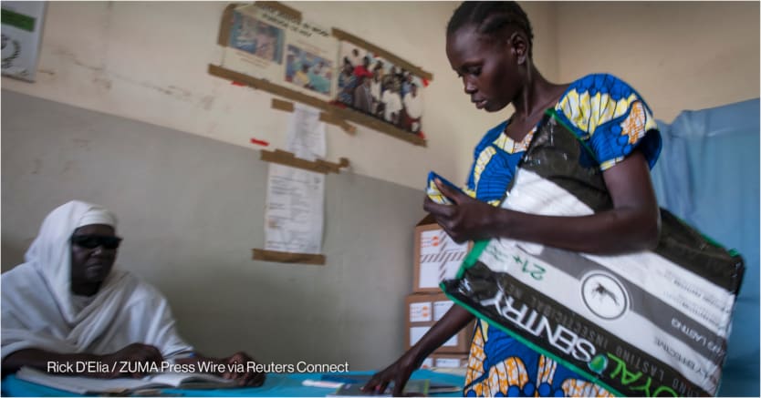 A mother receives mosquito nets during their checkup at a health care center in Juba, South Sudan.
