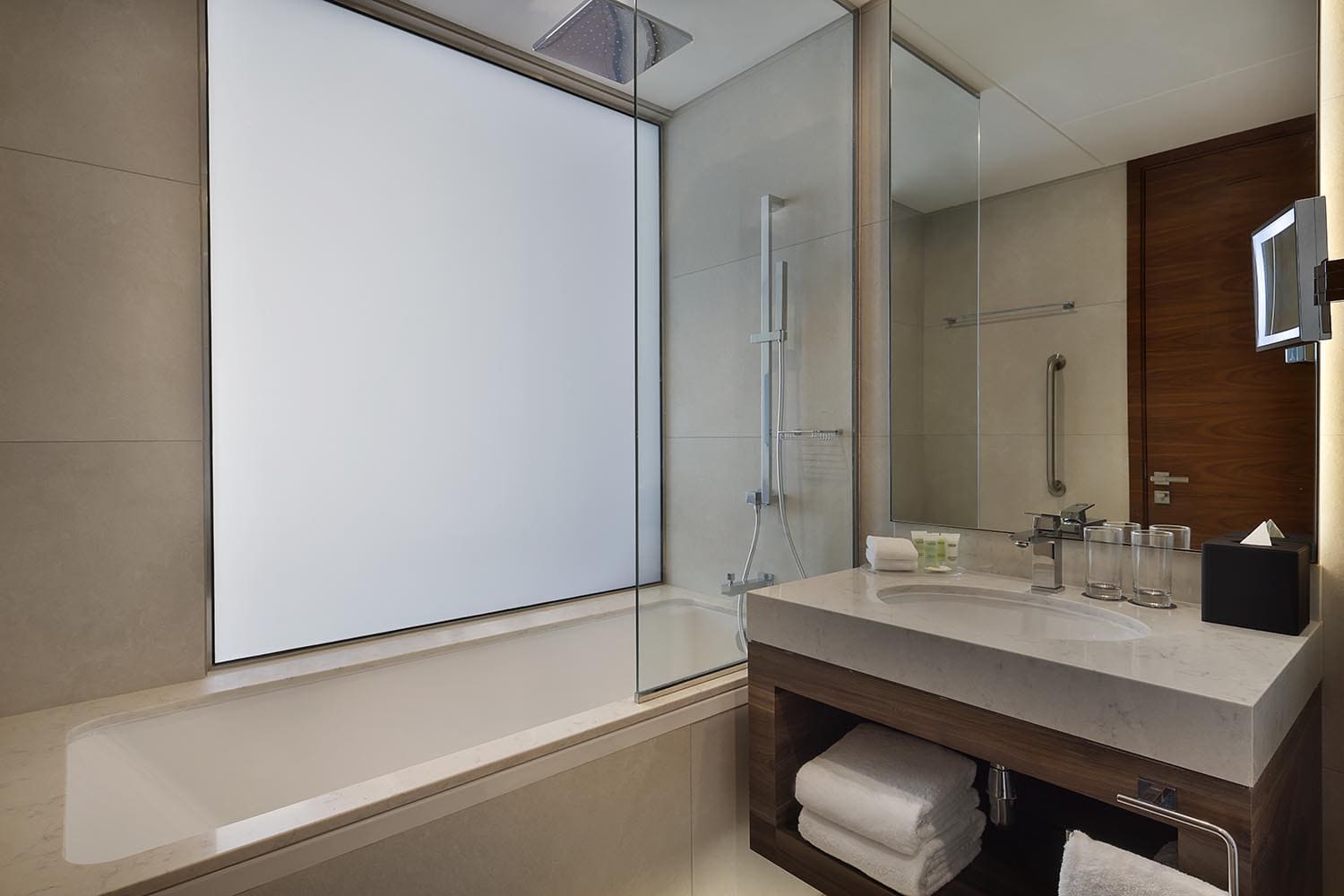Twin bed bathroom with sink and tub