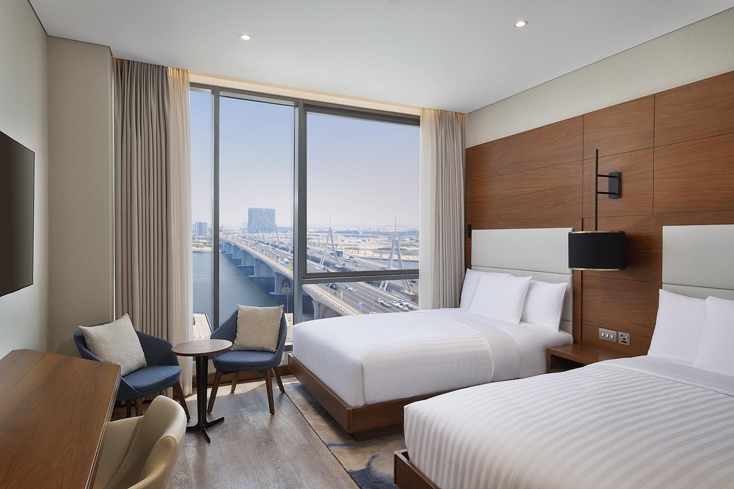 Twin bed guestroom facing business bay bridge