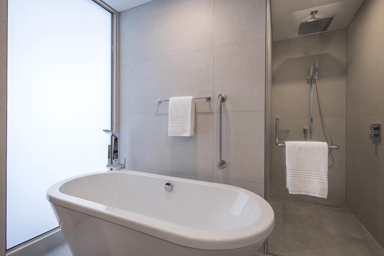 Suite bathroom with tub and shower