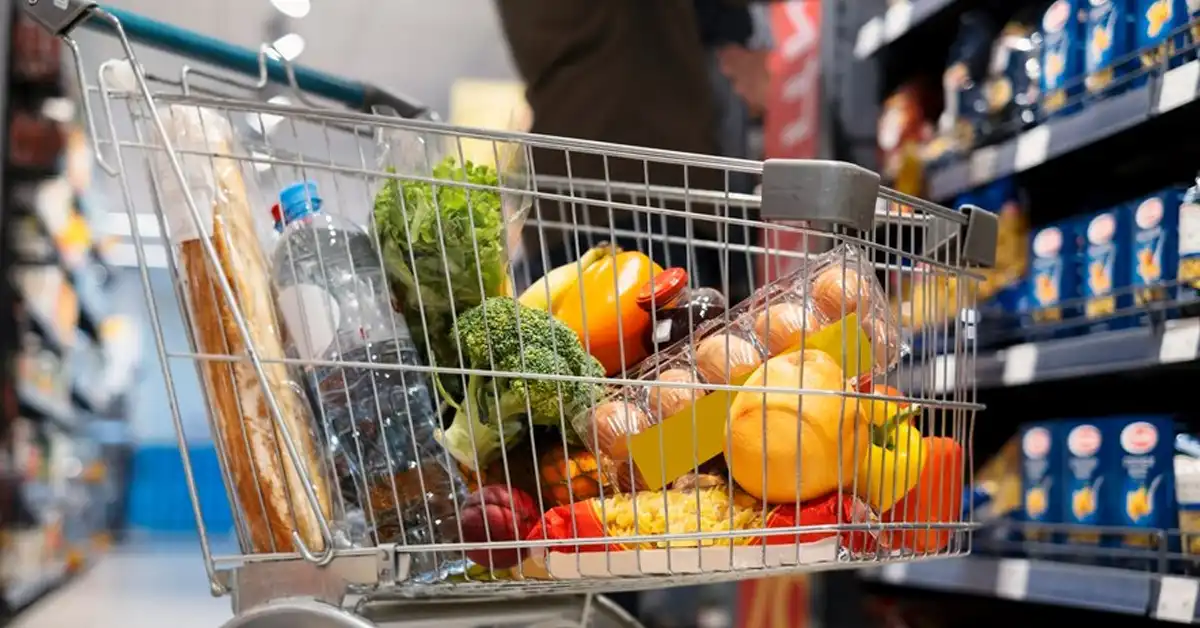 A well-stocked shopping cart with a variety of fresh produce and essentials, showcasing thoughtful preparation for the week ahead