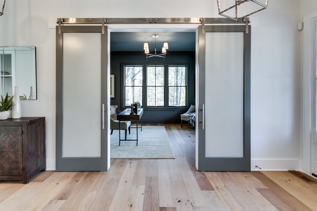 Pair of glass-paneled sliding doors framing a finished interior