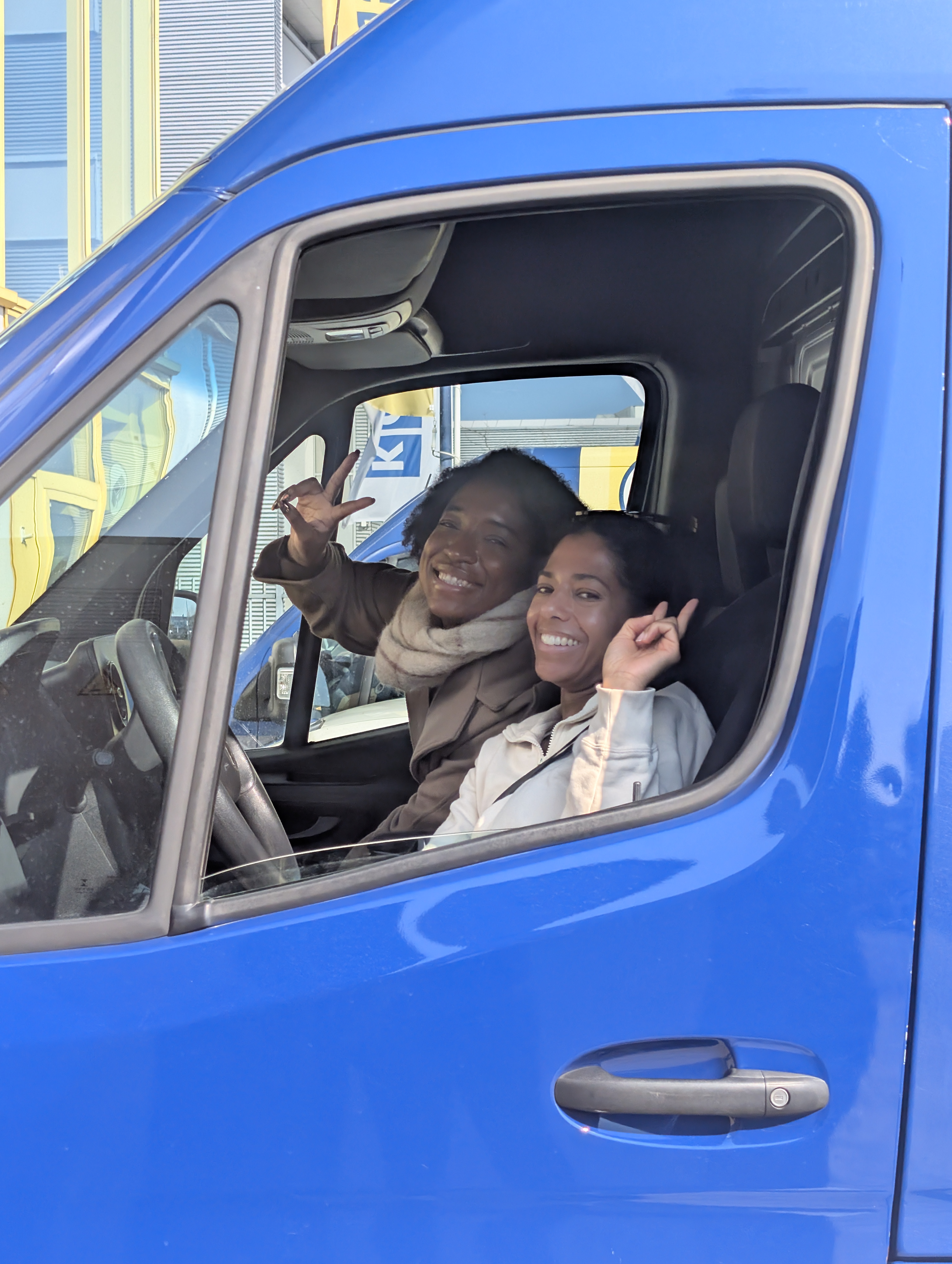 Rachel and Shuante posing in the van
