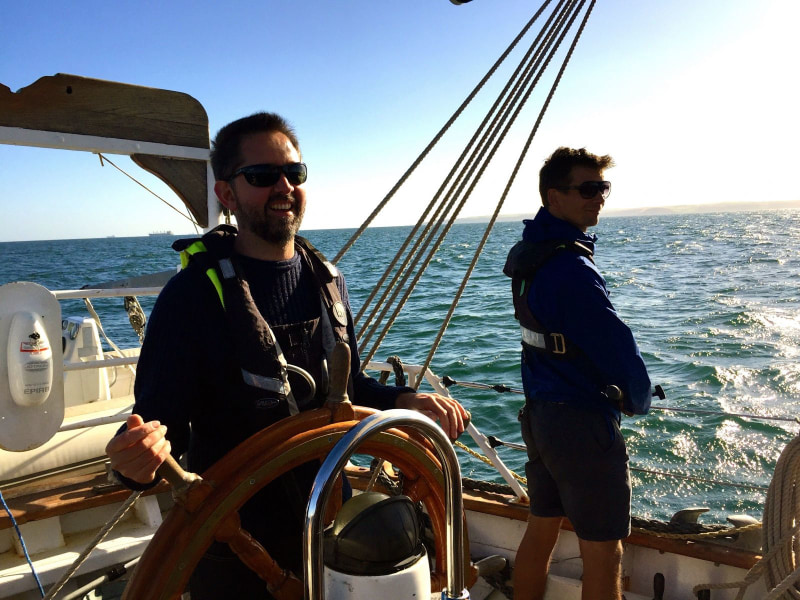 steering at the helm sailing