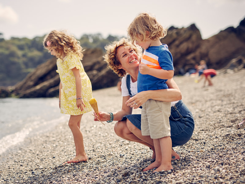 Trebah Garden in Cornwall beach with a happy family