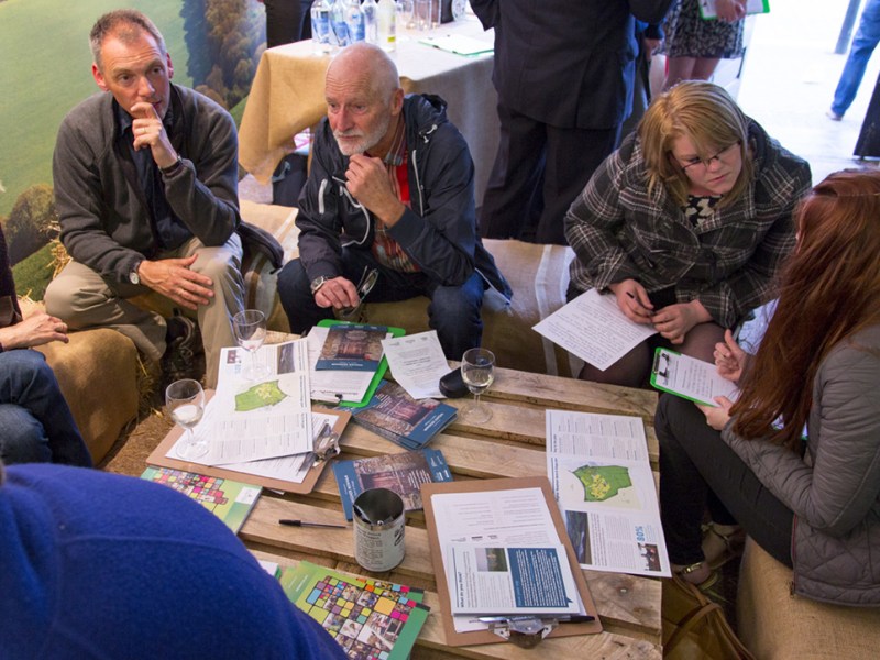 Higher Newham exhibition people discussing the project