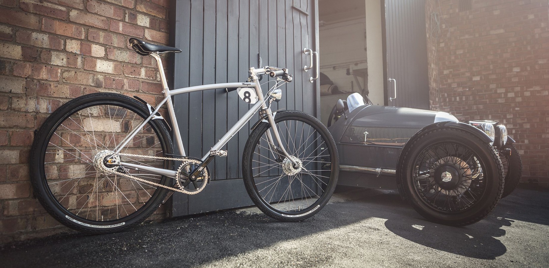 Pashley-Morgan 8 bike next to a Morgan classic car