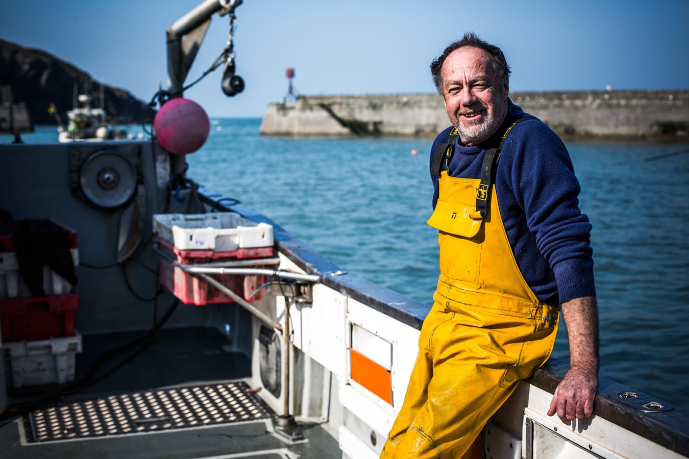 Fisherman at port issacc in cornwall fishing for fresh fish