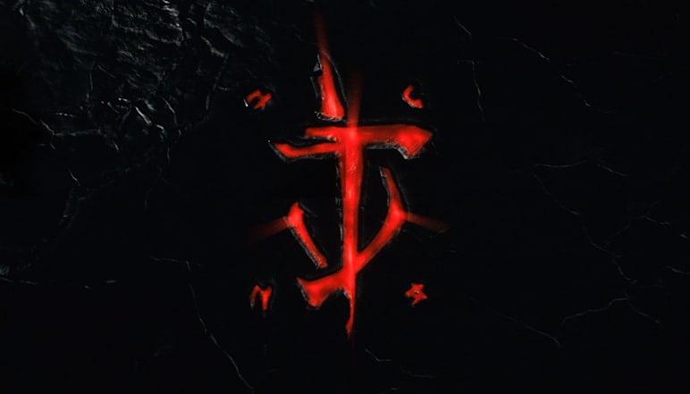 Image of the mark of the slayer in red on a dark slate background