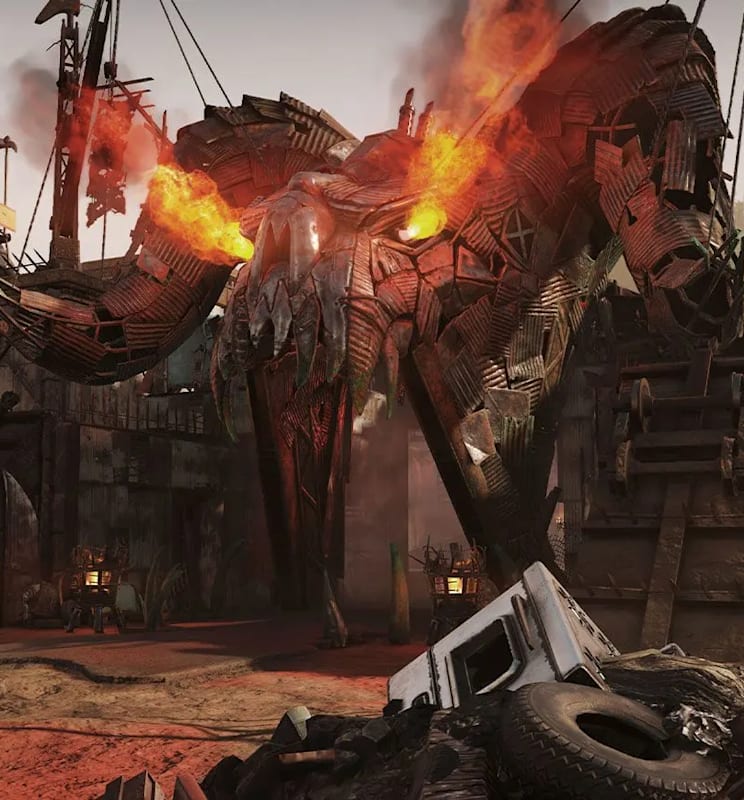 A fortified barricade wall adorned with a flaming Deathclaw effigy made from scrap.