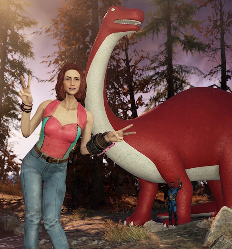A woman posing in front of a brontosaurus.
