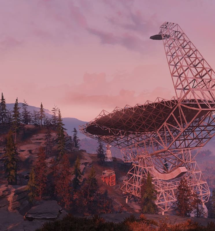 A satellite sits on top of a mountain.