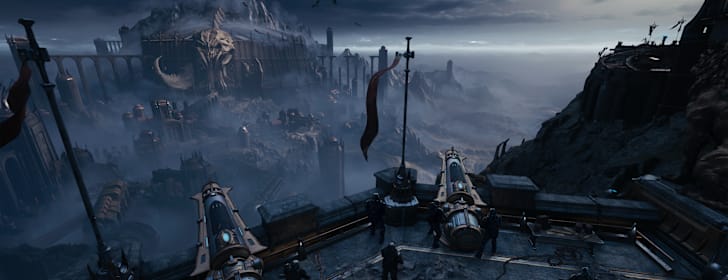 A cannon emplacement overlooks a war-torn village