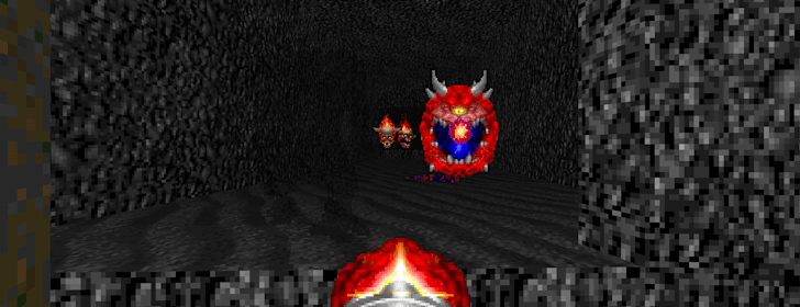 The player fires their Minigun at a flying Cacodemon