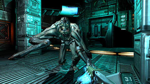 The player attempts to attack a demon with a plasma weapon in DOOM 3