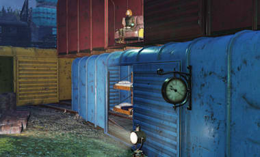 C.A.M.P. built from stacked rusted train cars with lit interior, spotlights, and a water tower visible at dusk in Appalachia.
