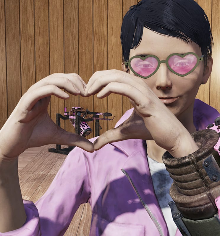 A player in the Hot Rod Pink Flamer skin making a heart with their hands.