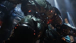 The building-sized Atlan mech imposes from above.