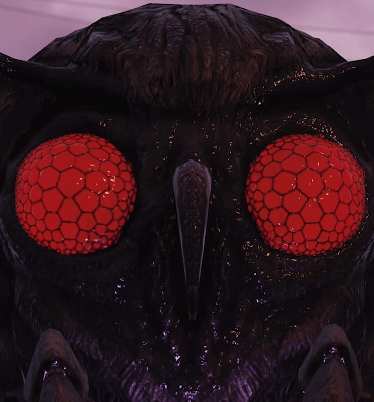 Closeup of a Mothman with its large, red eyes staring right at the viewer.