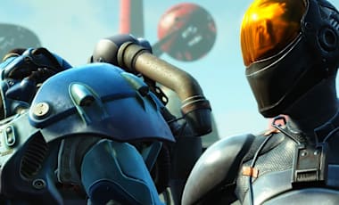A character in blue painted Power Armor stands next to another character in a stealth suit.