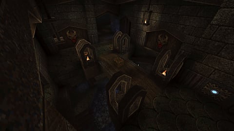 Underground ruins with torches.