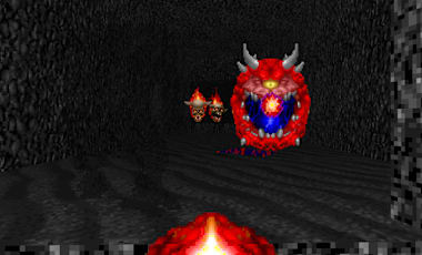 The player fires their Minigun at a flying Cacodemon