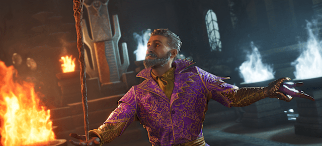 A man with glowing eyes holding a staff as blue and orange flames burn in the background