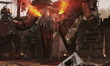 A fortified barricade wall adorned with a flaming Deathclaw effigy made from scrap.