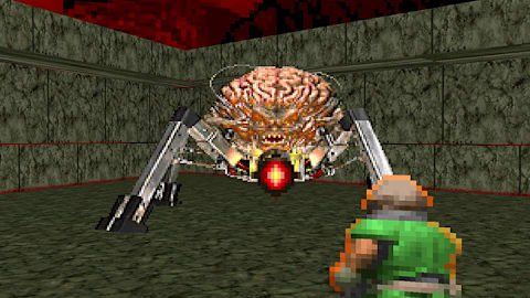 DOOMguy faces against the imposing Spider Mastermind in DOOM (1993)