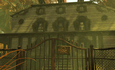 Weathered haunted C.A.M.P. house stands behind a rusted gate marked with a skull-and-crossbones, surrounded by autumn trees.